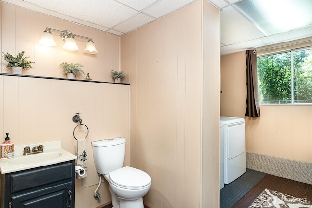 13605 SE 233rd St, Kent, WA 98042 - bathroom with washer / clothes dryer, vanity, wood finished floors, and a paneled ceiling