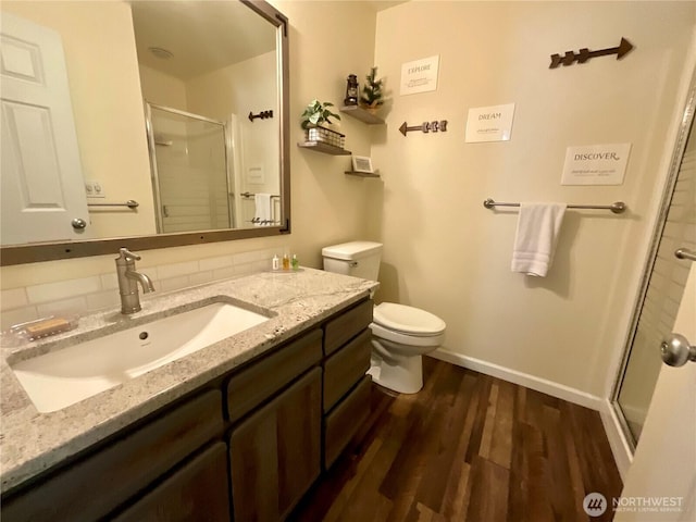 20795 Kahler Dr Unit E7, Leavenworth, WA 98826 - bathroom with a stall shower, wood finished floors, vanity, and backsplash
