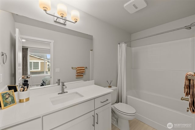 12124 NE 194th Ct Unit C, Bothell, WA 98011 - full bathroom featuring vanity, shower / tub combo with curtain, ensuite bathroom, and wood finished floors