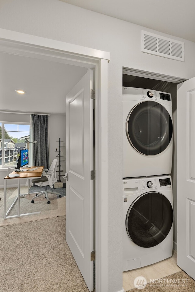 12124 NE 194th Ct Unit C, Bothell, WA 98011 - laundry area with stacked washing machine and dryer and carpet flooring