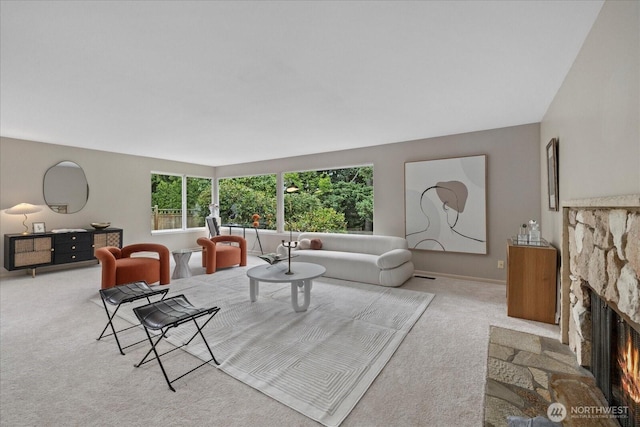 6520 NE 60th St, Seattle, WA 98115 - carpeted living room with a fireplace and baseboards
