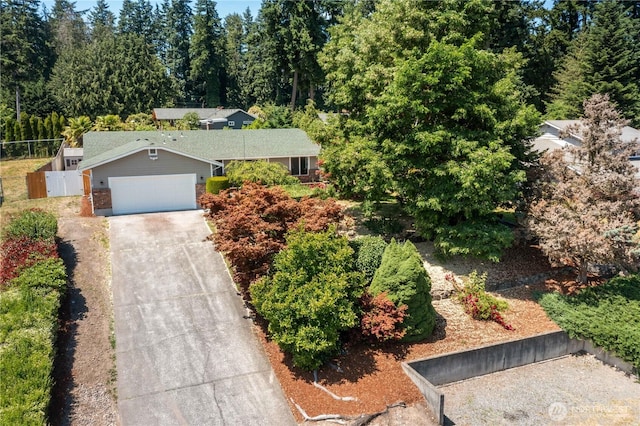 10218 63rd Avenue Ct E, Puyallup, WA 98373 - ranch-style house with driveway, an attached garage, and brick siding