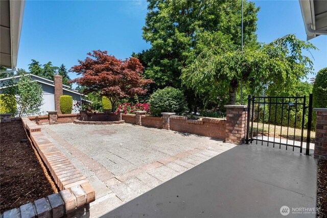 10218 63rd Avenue Ct E, Puyallup, WA 98373 - view of patio with a gate