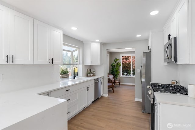 10218 63rd Avenue Ct E, Puyallup, WA 98373 - kitchen with appliances with stainless steel finishes, white cabinetry, plenty of natural light, and recessed lighting