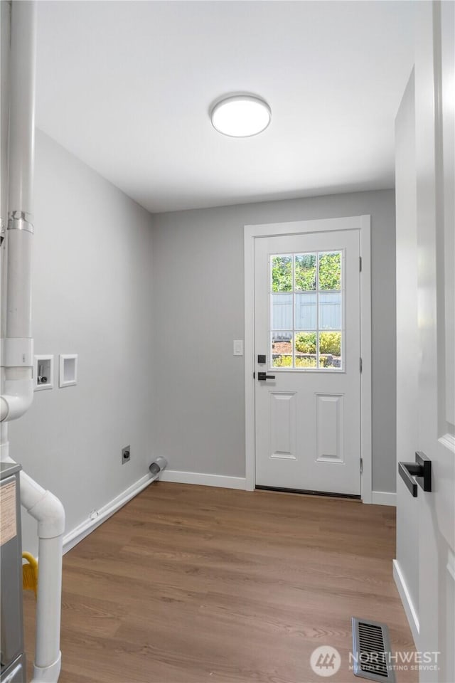 10218 63rd Avenue Ct E, Puyallup, WA 98373 - laundry room featuring washer hookup, wood finished floors, and electric dryer hookup