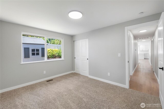 10218 63rd Avenue Ct E, Puyallup, WA 98373 - unfurnished bedroom featuring carpet and a closet