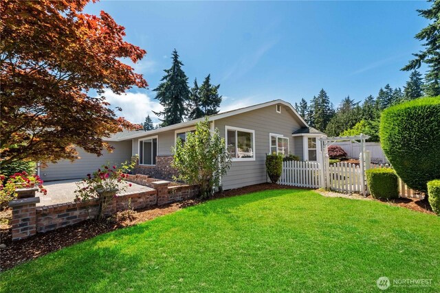 10218 63rd Avenue Ct E, Puyallup, WA 98373 - ranch-style house with a patio area