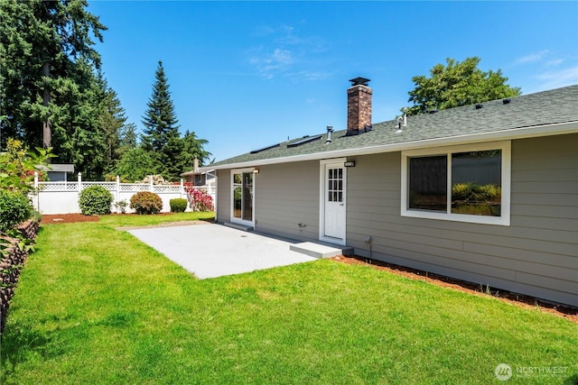 10218 63rd Avenue Ct E, Puyallup, WA 98373 - rear view of house with a patio area and a chimney