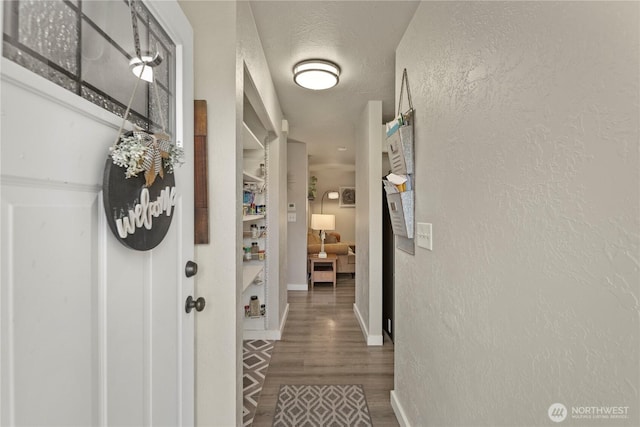 1216 NE Vena Ave, Bremerton, WA 98311 - corridor with wood finished floors and a textured wall