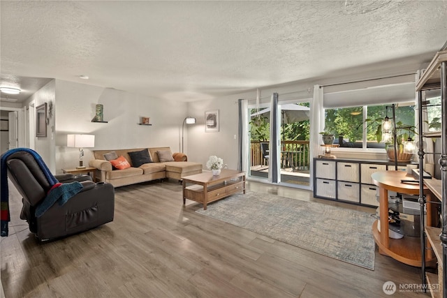 1216 NE Vena Ave, Bremerton, WA 98311 - living room with a textured ceiling and wood finished floors