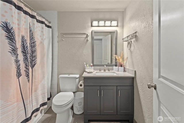 1216 NE Vena Ave, Bremerton, WA 98311 - full bathroom with a textured wall, vanity, curtained shower, and tile patterned floors