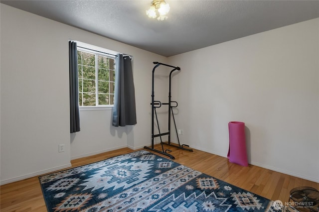 6314 75th Avenue Ct W, University Place, WA 98467 - exercise room with wood finished floors and a textured ceiling