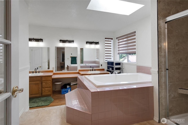 6314 75th Avenue Ct W, University Place, WA 98467 - full bath with a garden tub, a shower stall, vanity, and a skylight