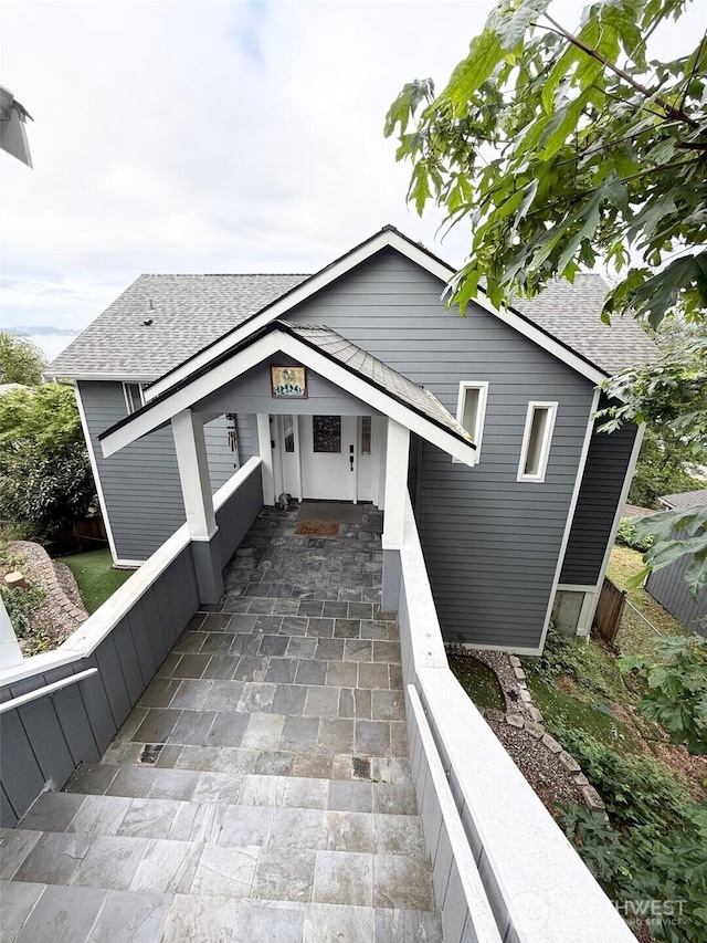 9844 Arrowsmith Ave S, Seattle, WA 98118 - view of front of house featuring a shingled roof