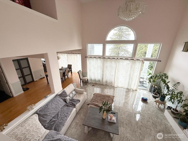9844 Arrowsmith Ave S, Seattle, WA 98118 - living area featuring a high ceiling and a chandelier
