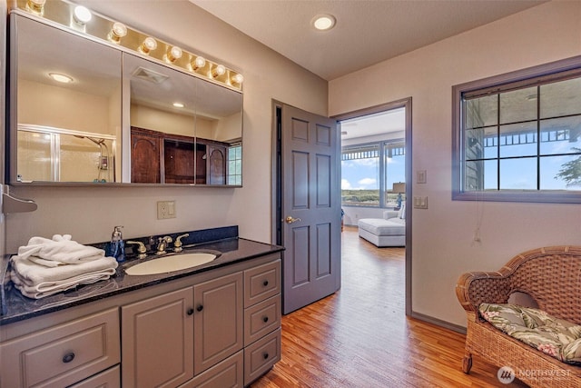 23309 J Pl, Ocean Park, WA 98640 - bathroom featuring wood finished floors, vanity, an enclosed shower, and recessed lighting