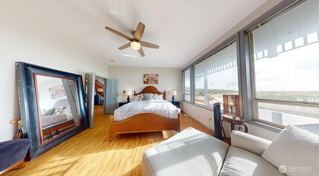 23309 J Pl, Ocean Park, WA 98640 - bedroom with wood finished floors and a ceiling fan