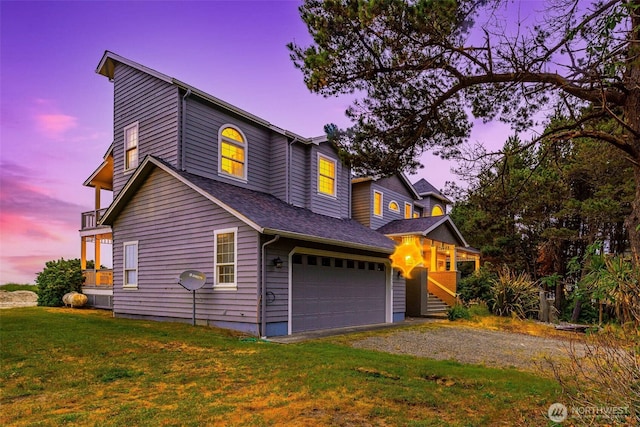 23309 J Pl, Ocean Park, WA 98640 - view of front of property featuring a front lawn, an attached garage, dirt driveway, and roof with shingles