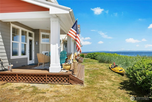 32 Heron Rd, Port Ludlow, WA 98365 - view of grassy yard featuring a deck with water view