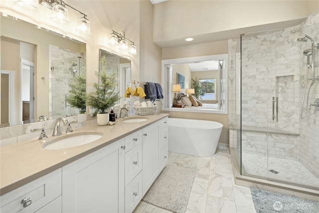32 Heron Rd, Port Ludlow, WA 98365 - full bathroom featuring a stall shower, marble finish flooring, double vanity, and a soaking tub