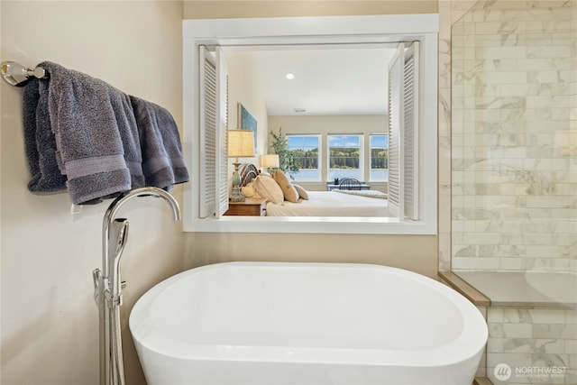 32 Heron Rd, Port Ludlow, WA 98365 - bathroom featuring a freestanding bath and a water view