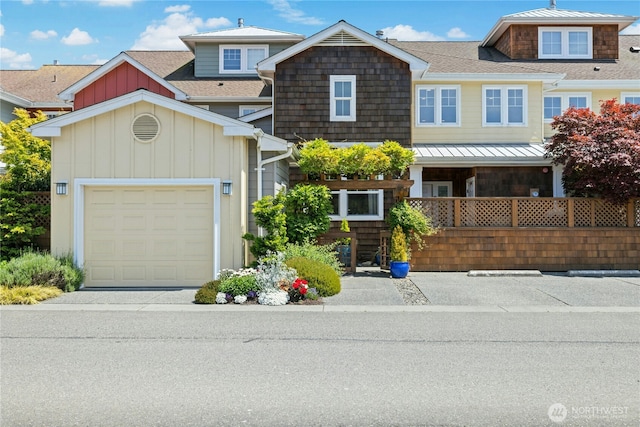 32 Heron Rd, Port Ludlow, WA 98365 - view of front of property featuring board and batten siding, a shingled roof, and a garage
