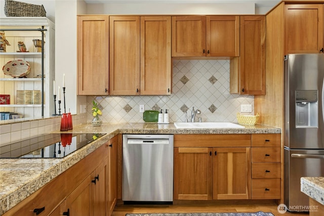 32 Heron Rd, Port Ludlow, WA 98365 - kitchen featuring stainless steel appliances, tasteful backsplash, tile counters, and light wood-type flooring