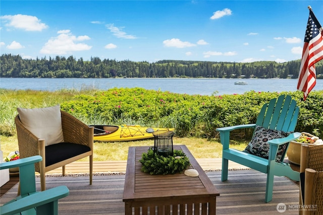 32 Heron Rd, Port Ludlow, WA 98365 - wooden terrace featuring a wooded view and a water view