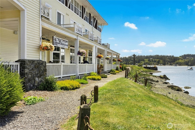 32 Heron Rd, Port Ludlow, WA 98365 - view of yard featuring a porch and a water view