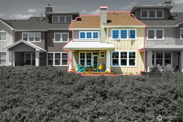 32 Heron Rd, Port Ludlow, WA 98365 - rear view of property featuring board and batten siding, a chimney, and a shingled roof