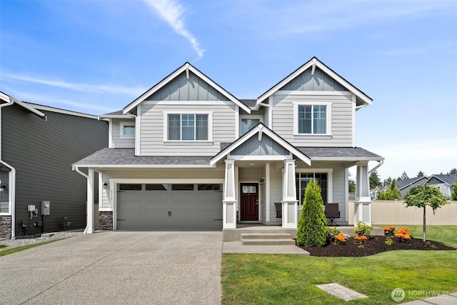 3115 Stephanie Loop NE, Lacey, WA 98516 - craftsman house featuring board and batten siding, driveway, a garage, and roof with shingles