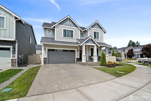 3115 Stephanie Loop NE, Lacey, WA 98516 - craftsman inspired home featuring board and batten siding, an attached garage, driveway, stone siding, and a porch