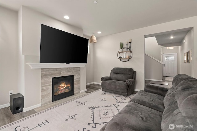 3115 Stephanie Loop NE, Lacey, WA 98516 - living area featuring wood finished floors, a tiled fireplace, and recessed lighting