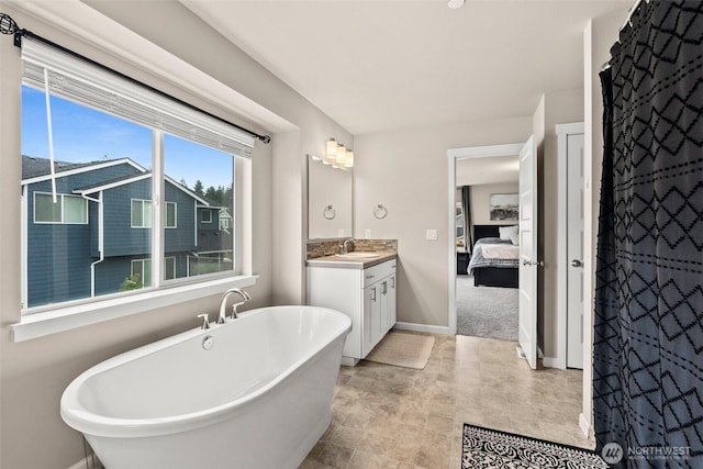 3115 Stephanie Loop NE, Lacey, WA 98516 - ensuite bathroom featuring vanity and a soaking tub