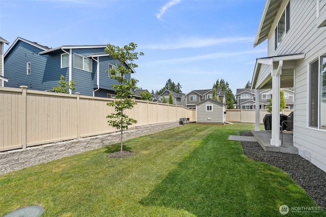 3115 Stephanie Loop NE, Lacey, WA 98516 - fenced backyard with a storage unit, a residential view, and a patio area