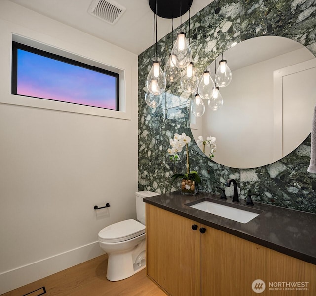 10425 NE 28th Pl, Bellevue, WA 98004 - bathroom with vanity, wood finished floors, and tasteful backsplash