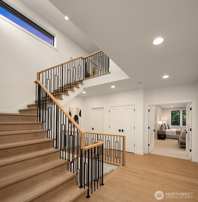 10425 NE 28th Pl, Bellevue, WA 98004 - stairs with recessed lighting and wood finished floors
