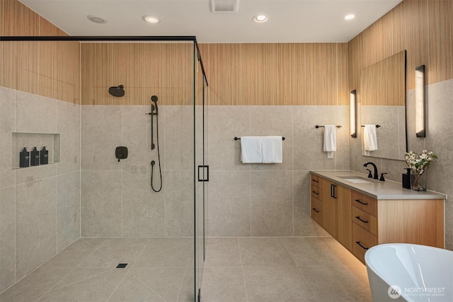 10425 NE 28th Pl, Bellevue, WA 98004 - full bath featuring a stall shower, vanity, a freestanding tub, recessed lighting, and tile patterned flooring