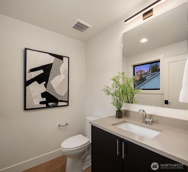 10425 NE 28th Pl, Bellevue, WA 98004 - bathroom with vanity, wood finished floors, and recessed lighting