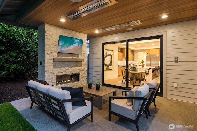 10425 NE 28th Pl, Bellevue, WA 98004 - view of patio / terrace with an outdoor living space with a fireplace and outdoor dining space
