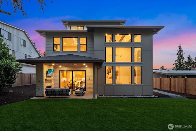 10425 NE 28th Pl, Bellevue, WA 98004 - back of house with outdoor lounge area, a fenced backyard, and a patio