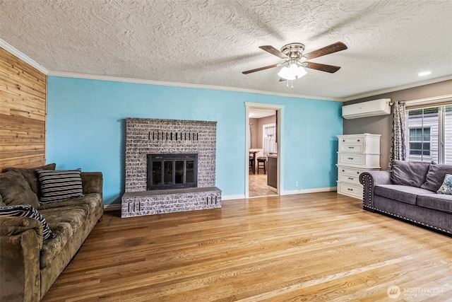 516 26th Ave, Longview, WA 98632 - living room featuring a wall mounted air conditioner, wood finished floors, ceiling fan, ornamental molding, and a fireplace