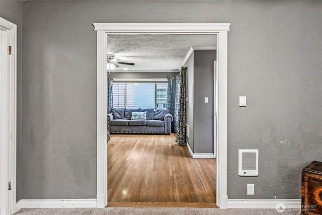 516 26th Ave, Longview, WA 98632 - corridor featuring wood finished floors, ornamental molding, a textured ceiling, and heating unit