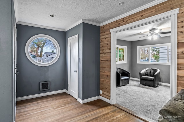 516 26th Ave, Longview, WA 98632 - entrance foyer featuring a textured ceiling, plenty of natural light, wood finished floors, a ceiling fan, and ornamental molding
