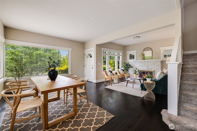 4745 35th Ave SW, Seattle, WA 98126 - dining space featuring plenty of natural light, dark wood-style floors, stairs, and a fireplace