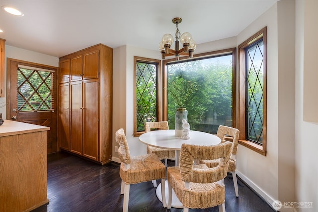 4745 35th Ave SW, Seattle, WA 98126 - dining room with dark wood-style floors, a chandelier, and recessed lighting