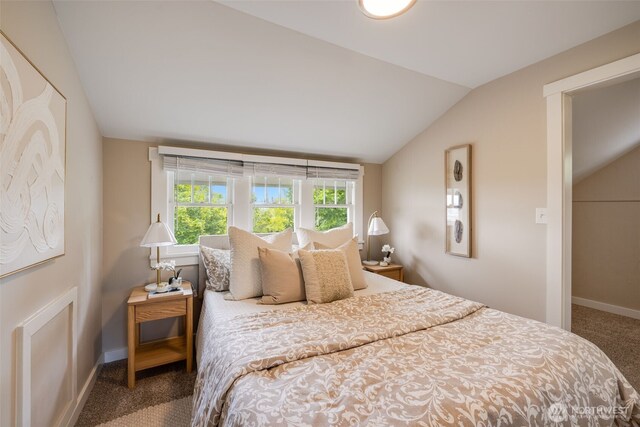 4745 35th Ave SW, Seattle, WA 98126 - carpeted bedroom with vaulted ceiling and baseboards