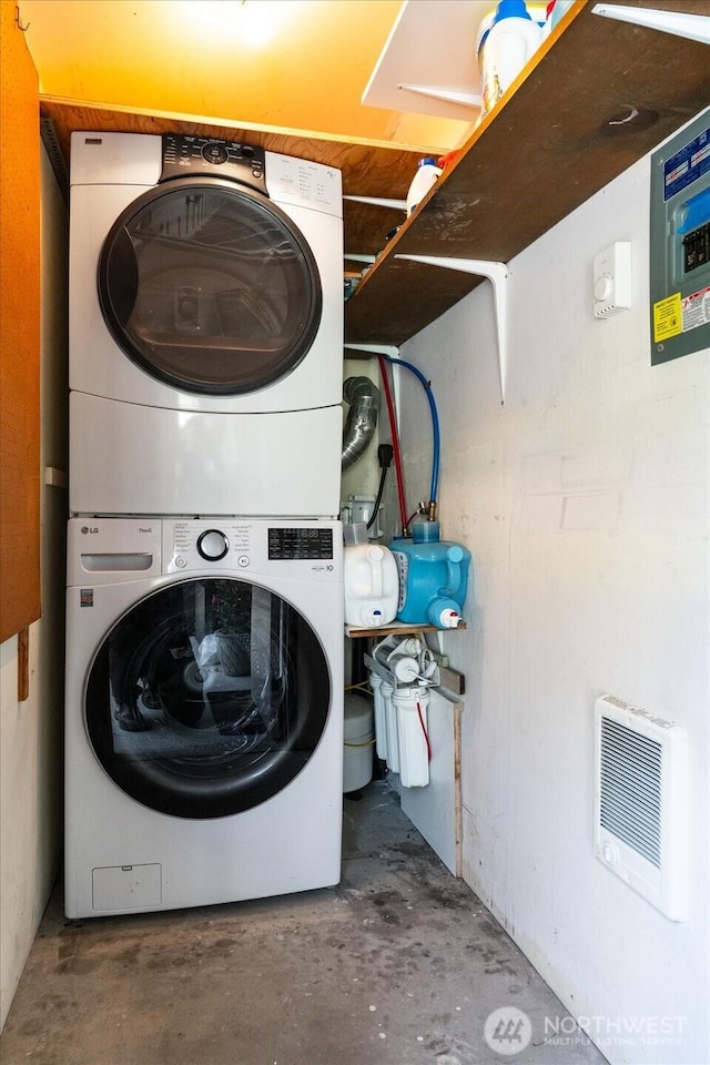 5029 84th St SW Unit 109, Mukilteo, WA 98275 - laundry room with estacked washer and dryer and heating unit