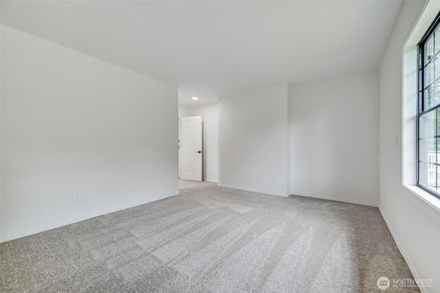 13428 SE 302nd Pl, Auburn, WA 98092 - spare room featuring light carpet and recessed lighting