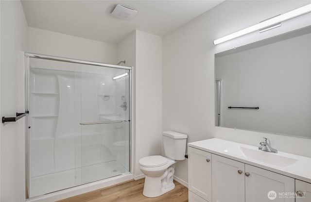 13428 SE 302nd Pl, Auburn, WA 98092 - bathroom featuring a shower stall, wood finished floors, and vanity